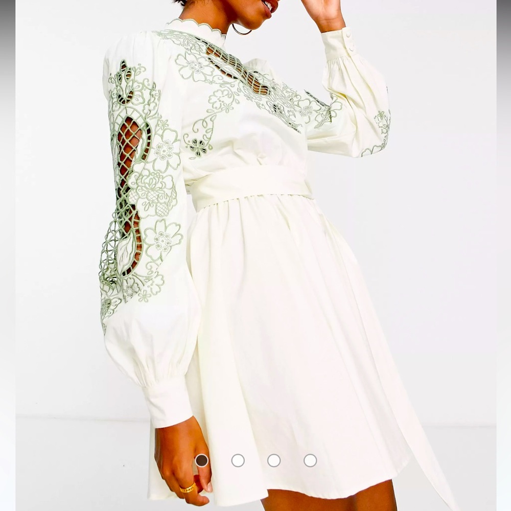 ASOS DESIGN high neck cutwork belted mini dress in stone with green detail.
